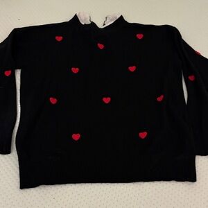 Sioni Black Turtleneck Sweater with Red Heart Accents